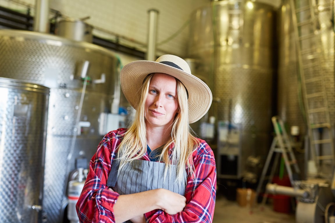 Female Winemaker in a Factory